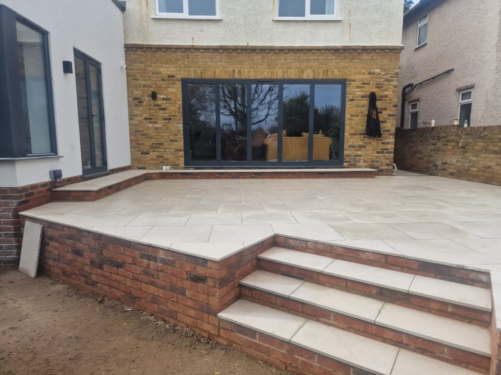 Multi-level raised patio with steps — SJ Landscapes